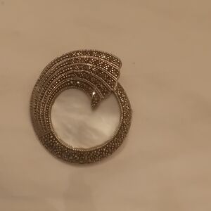 vintage-style marcasite and mother of pearl swirl brooch